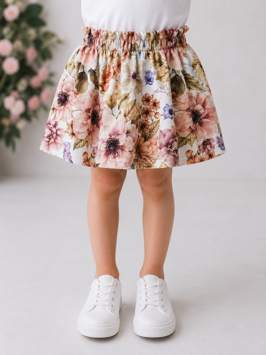Spódniczka dziewczęca w kwiaty  – elegancka, rozkloszowana